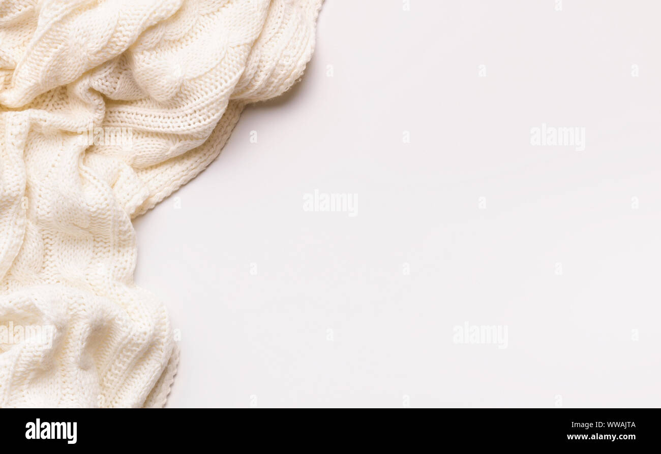 White autumn warm scarf on white background with copy space Stock Photo