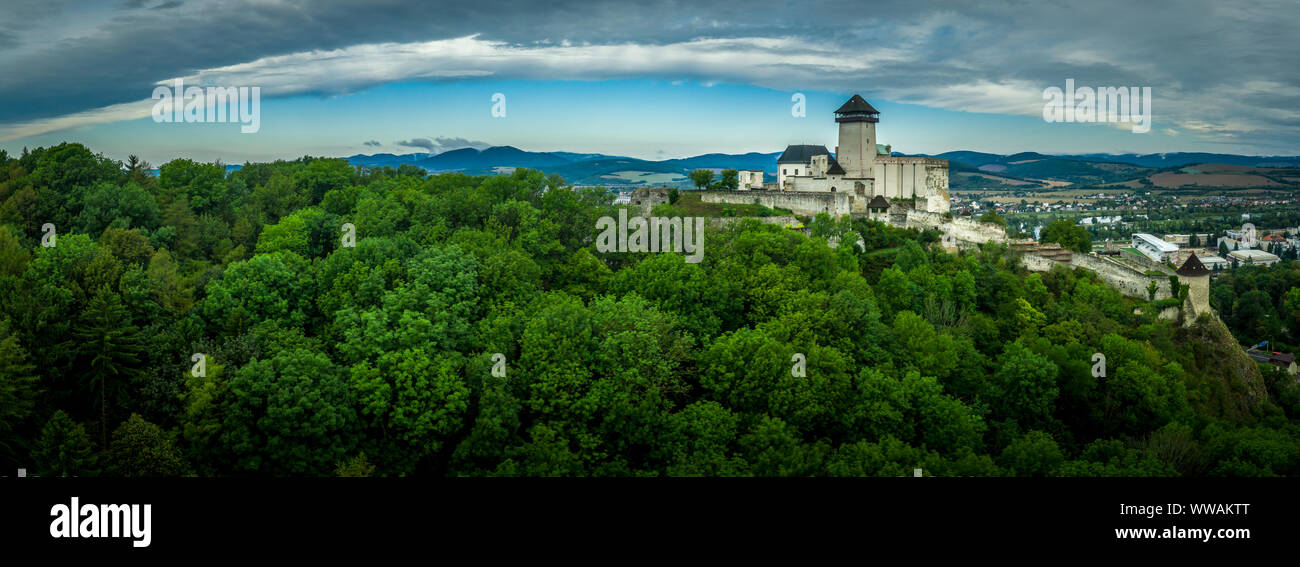 Aerial panorama of Trencin castle above the Vah river in Slovakia with dramatic sky Stock Photo