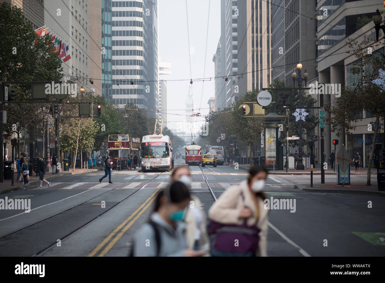 San Francisco, California - November 17, 2018: San Francisco’s Market Street is inundated with smoke from the Camp Fire in Northern California. Stock Photo