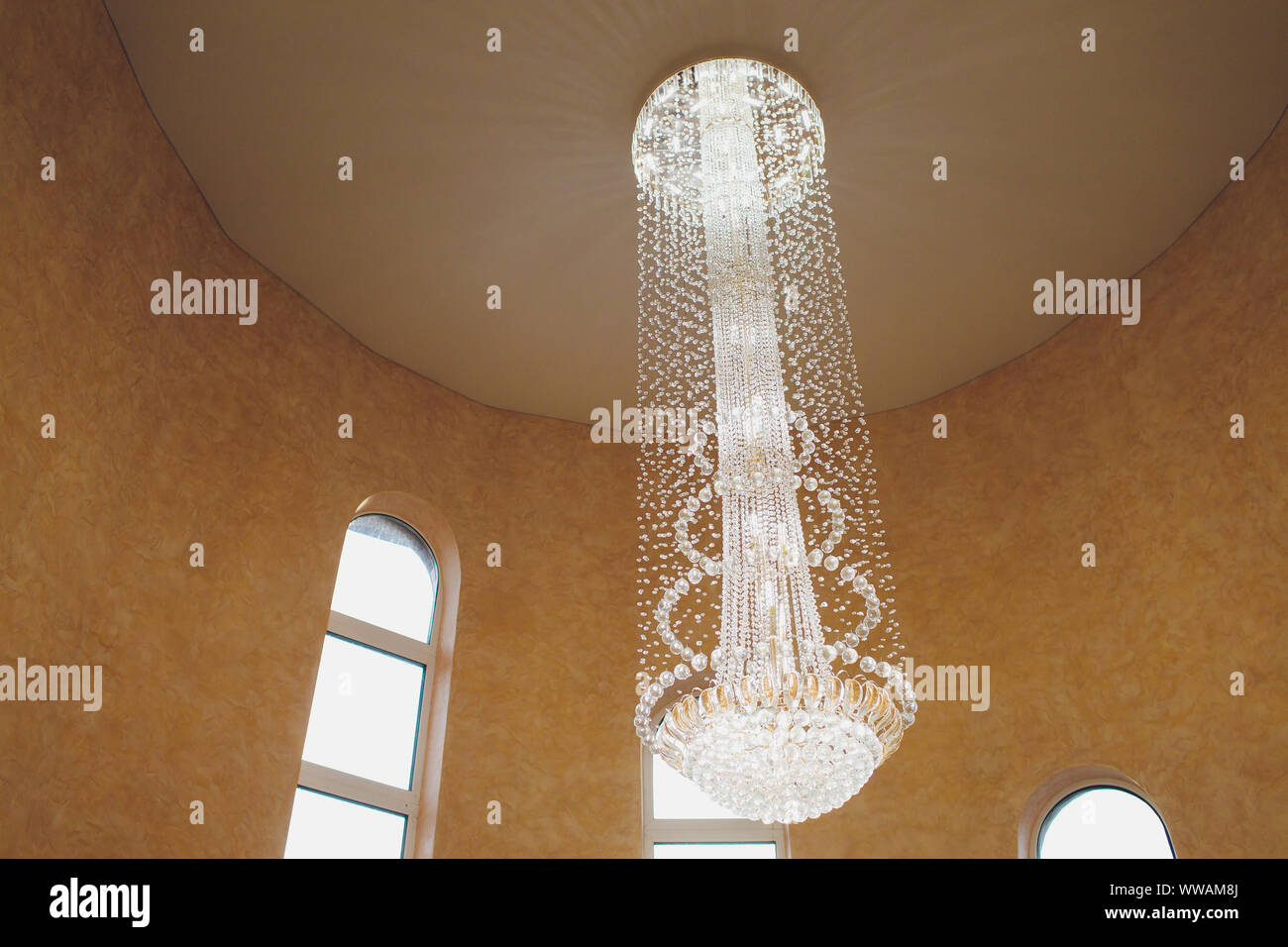 Front View Of Long Mirror Between Windows With Luxury Curtains