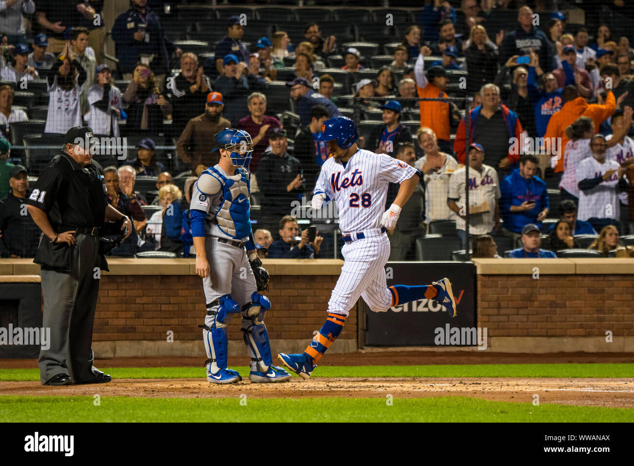 Queens, New York, USA. 13th Sep, 2019. New York Mets third baseman J.D. Davis (28) rounds home plate after hitting a home run during the game between The New York Mets and The Los Angeles Dodgers at Citi Field in Queens, New York. Mandatory credit: Kostas Lymperopoulos/CSM/Alamy Live News Stock Photo