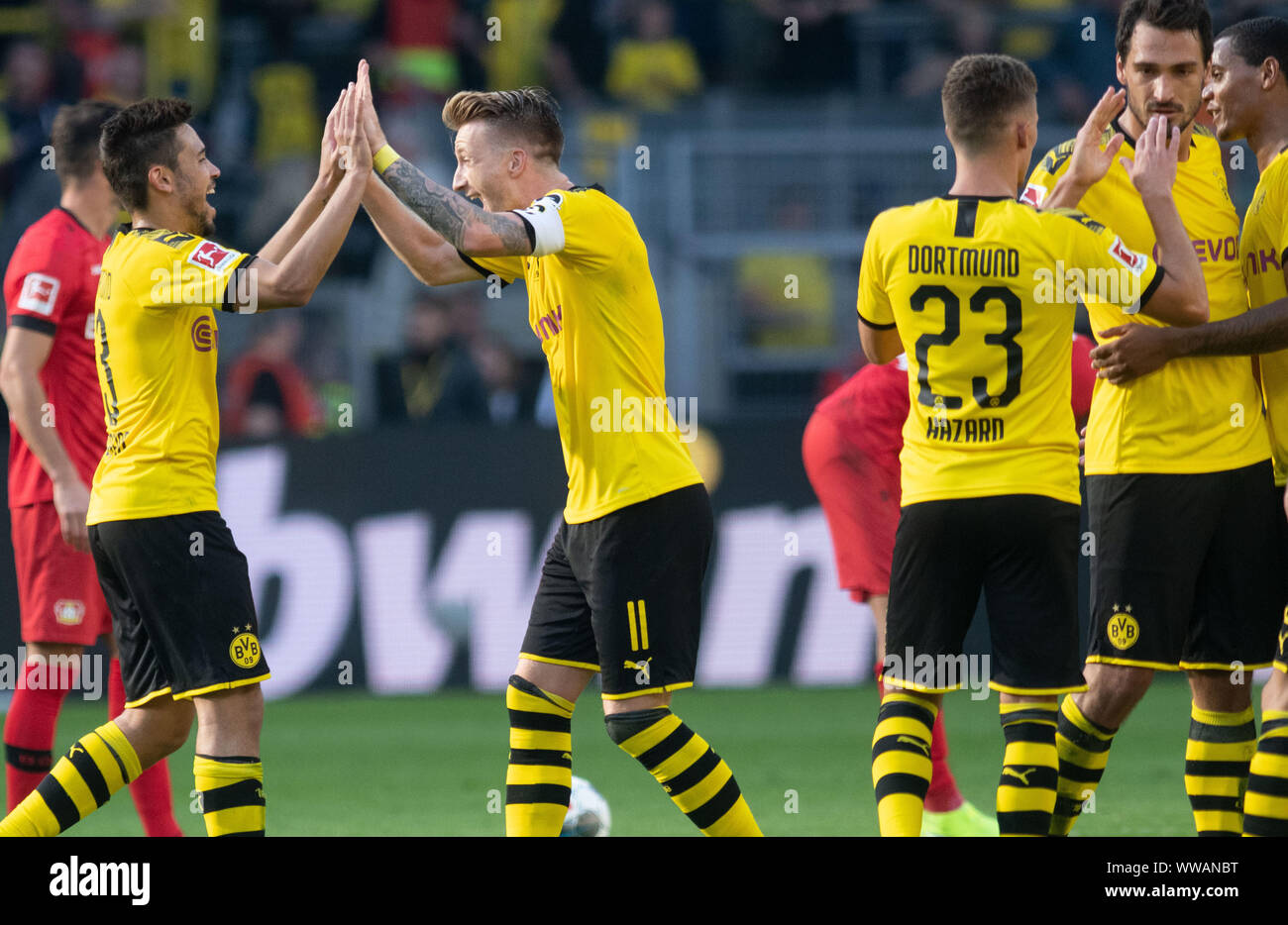 Dortmund, Germany. 14th Sep, 2019. Soccer: Bundesliga, Borussia Dortmund - Bayer Leverkusen, 4th matchday at Signal Iduna Park: Dortmund's Raphael Guerreiro (l) and Marco Reus clap their hands. Credit: Bernd Thissen/dpa - IMPORTANT NOTE: In accordance with the requirements of the DFL Deutsche Fußball Liga or the DFB Deutscher Fußball-Bund, it is prohibited to use or have used photographs taken in the stadium and/or the match in the form of sequence images and/or video-like photo sequences./dpa/Alamy Live News Stock Photo