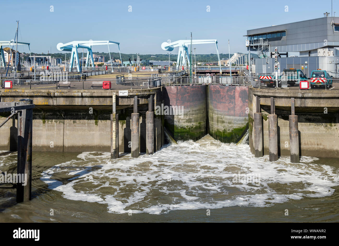 Water being released through one of the lock gates at Cardiff Bay before releasing the boats to the Bristol Channel Stock Photo