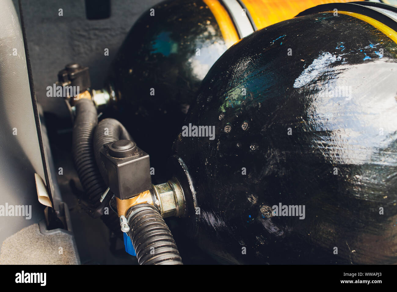 LPG , NGV Gas tanks are installed in a car for the 2 fuel system Stock