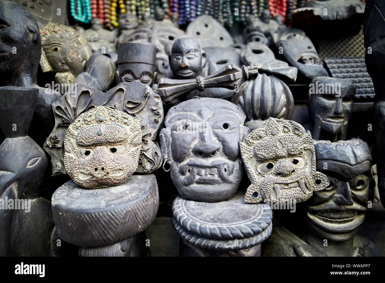 Tradition Nepalese masks carved from stone in the shop of Thamel district, Kathmandu valley, Nepal Stock Photo