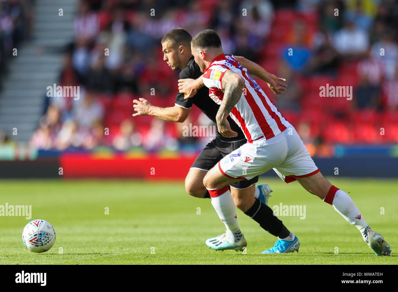 Stoke On Trent, UK. 14th Sep, 2019. Stoke City defender Tom Edwards (2) chases after Bristol City midfielder Tommy Rowe (25) during the EFL Sky Bet Championship match between Stoke City and Bristol City at the bet365 Stadium, Stoke-on-Trent, England on 14 September 2019. Photo by Jurek Biegus. Editorial use only, license required for commercial use. No use in betting, games or a single club/league/player publications. Credit: UK Sports Pics Ltd/Alamy Live News Stock Photo