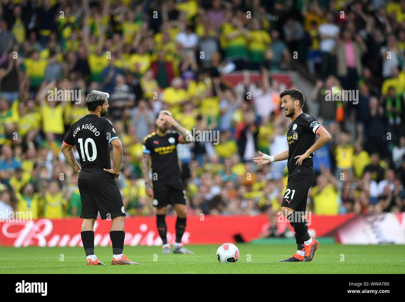 Manchester City's Sergio Aguero (left) and David Silva stand dejected after conceding the first goal during the Premier League match at Carrow Road, Norwich. Stock Photo