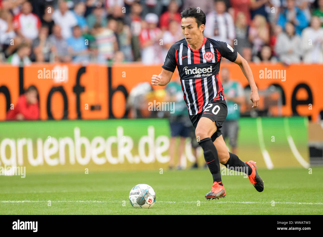 Augsburg, Germany. 14th Sep, 2019. Soccer: Bundesliga, FC Augsburg - Eintracht Frankfurt, 4th matchday in the WWK-Arena. Makoto Hasebe from Frankfurt plays the ball. Credit: Matthias Balk/dpa - IMPORTANT NOTE: In accordance with the requirements of the DFL Deutsche Fußball Liga or the DFB Deutscher Fußball-Bund, it is prohibited to use or have used photographs taken in the stadium and/or the match in the form of sequence images and/or video-like photo sequences./dpa/Alamy Live News Stock Photo