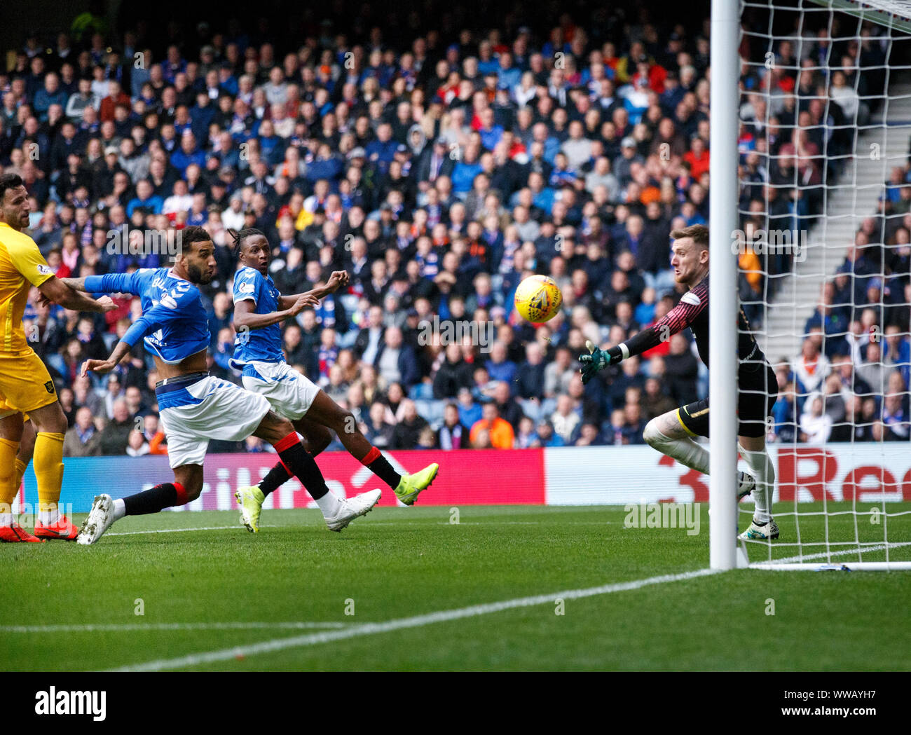 James Tavernier of Rangers (out of picture) scores from a free-kick beating everyone, including keeper Ross Stewart of Livingston during the Ladbrokes Scottish Premiership match at Ibrox, Glasgow. Stock Photo