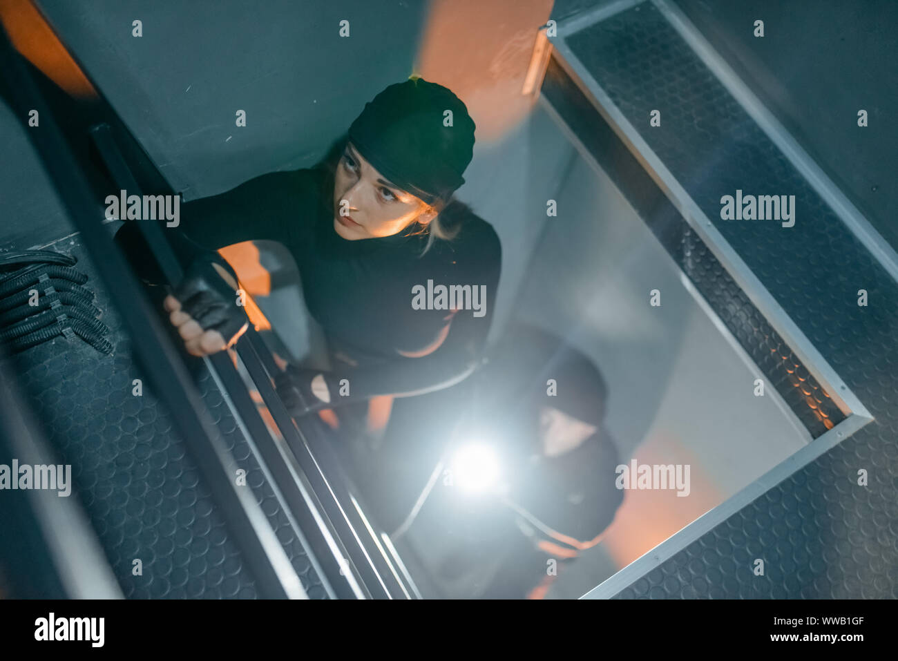 Robbers in uniform make their way into the vault Stock Photo