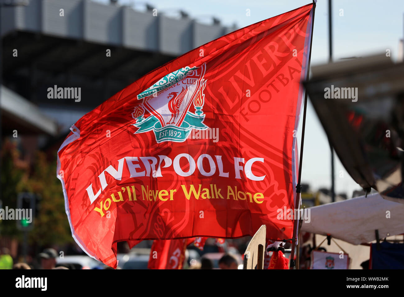 Liverpool, UK.14th September 2019; Anfield, Liverpool, Merseyside, England; English Premier League Football, Liverpool versus Newcastle United; a large Liverpool flag for sale at an unofficial merchandise stall outside the Kop - Strictly Editorial Use Only. No use with unauthorized audio, video, data, fixture lists, club/league logos or 'live' services. Online in-match use limited to 120 images, no video emulation. No use in betting, games or single club/league/player publications Credit: Action Plus Sports Images/Alamy Live News Credit: Action Plus Sports Images/Alamy Live News Stock Photo
