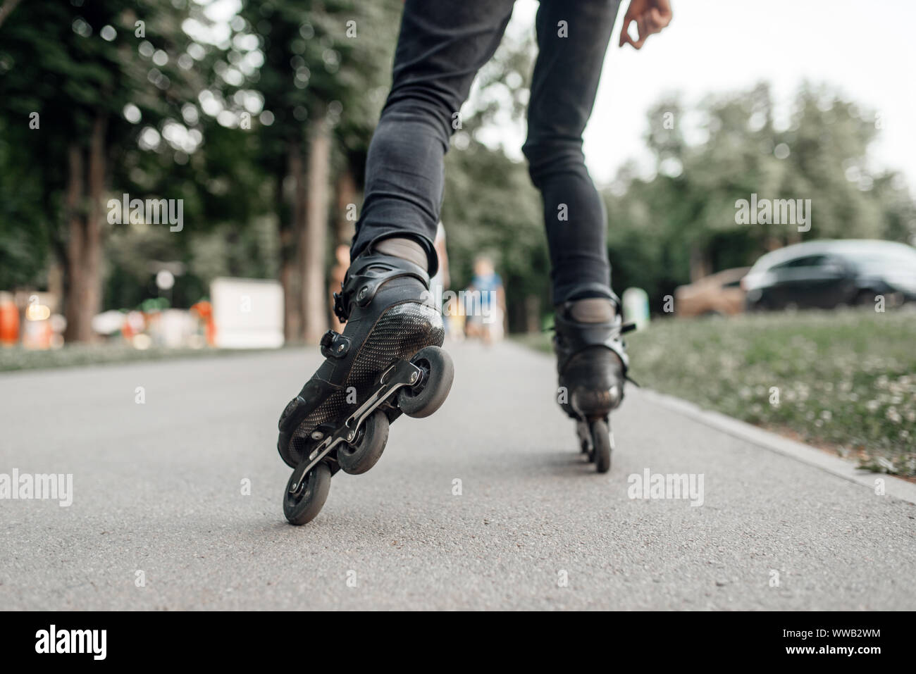 Roller skating, skater rolling, back view on legs Stock Photo Alamy