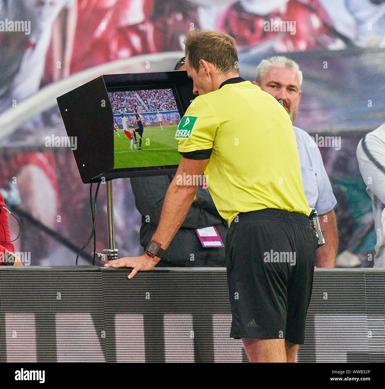 Leipzig, Germany. 14th Sep, 2019. Referee Sascha STEGEMANN with whistle,  gestures, shows, watch, individual action, checks Video assist,  videorecord, videoreferee, videotape, sign, hand to ear, call, radio, ask,  video, inquiry, video chirp,