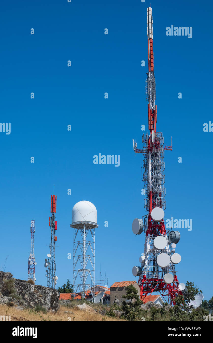 Group of antennas, satellite dishes for telecommunications, television broadcast, cellphone, radio and satellite. Electromagnetic and environmental po Stock Photo