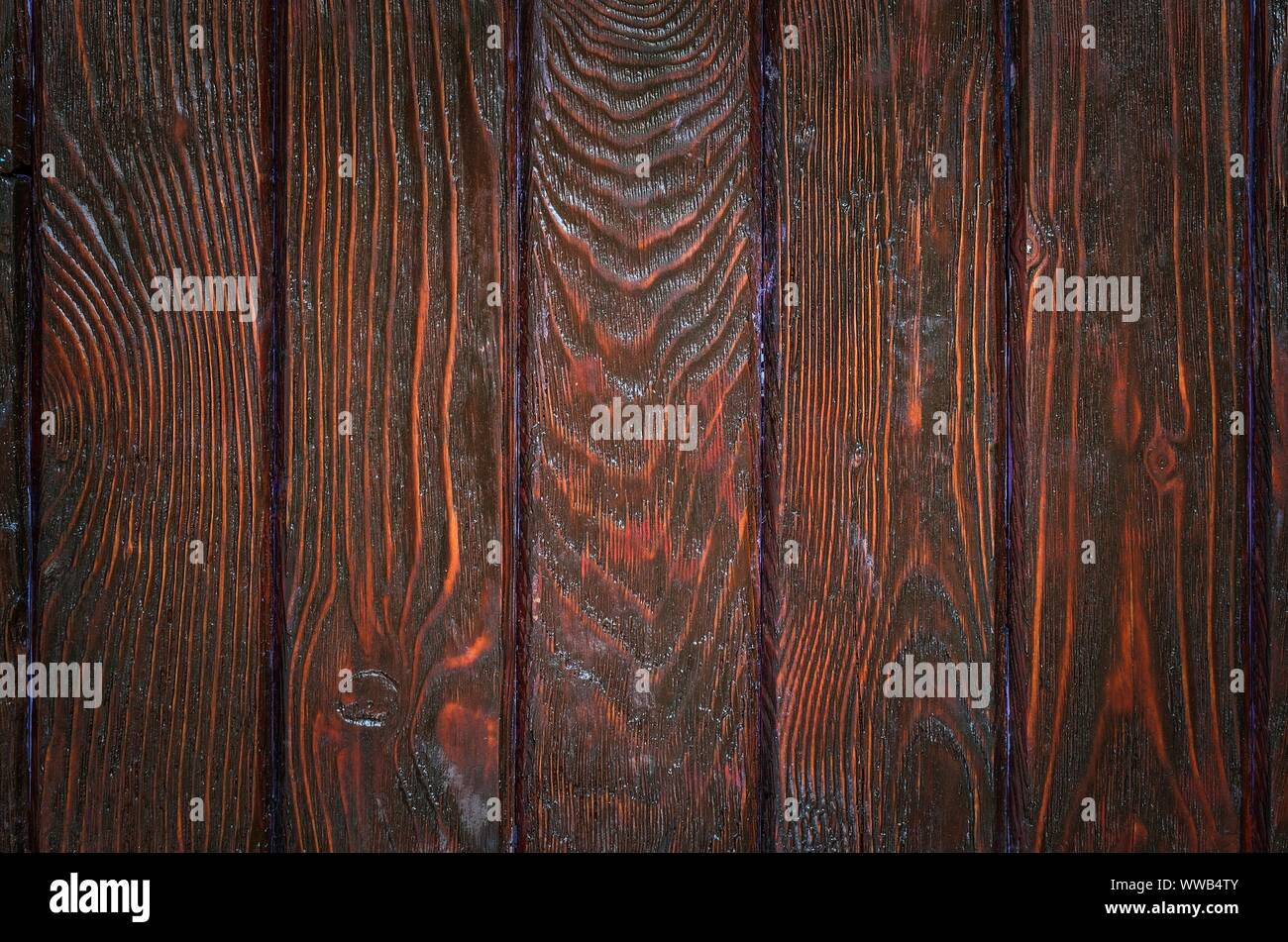 Wooden background texture. Creatively painted dark brown boards. Stock Photo
