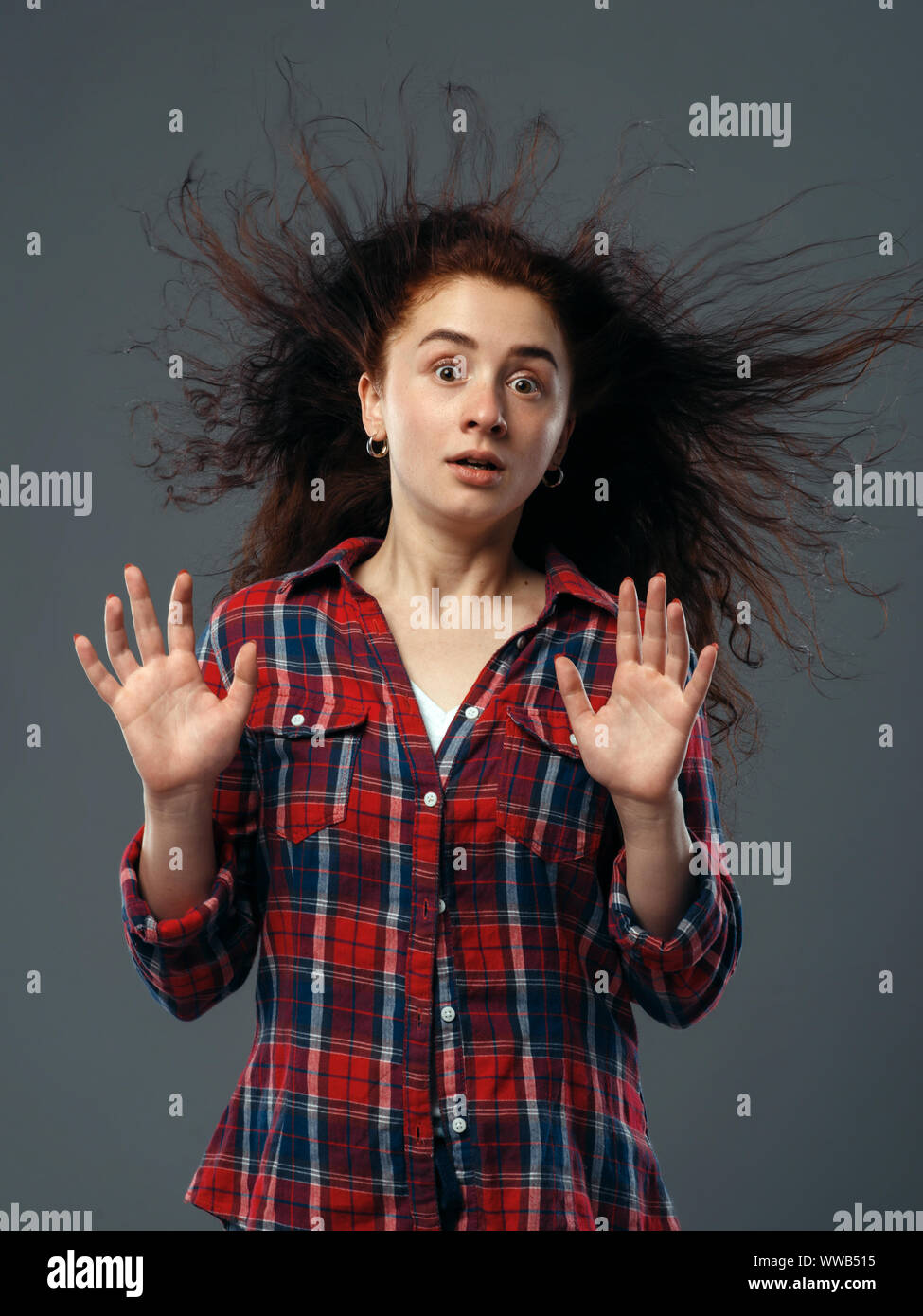 Strong fan blowing in female face, funny emotion Stock Photo Alamy