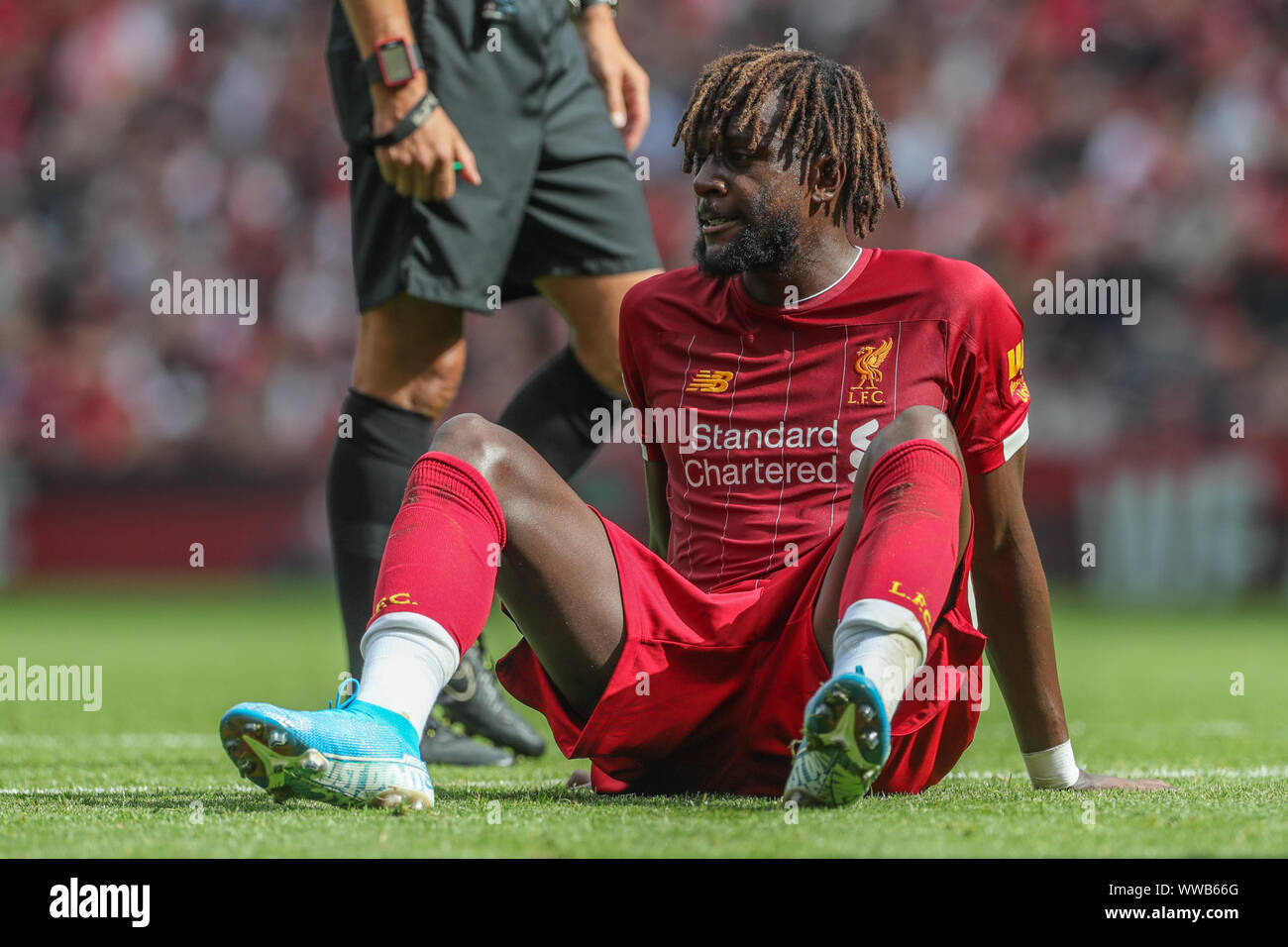 Liverpool, UK. 14th Sep, 2019. Premier League Football, Liverpool vs Newcastle United ; Divock Origi (27) of Liverpool sits injured on the floor Credit: Mark Cosgrove/News Images Premier League/EFL Football images are subject to DataCo Licence Credit: News Images /Alamy Live News Stock Photo
