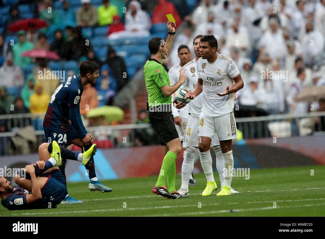 Madrid, Spain. 14th Sep, 2019. Madrid, Spain; 14/09/2019.Soccer of La Liga match 04 2019-2020 Real Madrid against Levante held at Santiago Bernabeu stadium in Madrid. Ricardo de Burgos referee shows yellow card to Casemiro Real Madrid player Final score 3-2 Real Madrid winners, two goals from Karim Benzema and another from Casemiro Credit: Juan Carlos Rojas/Picture Alliance | usage worldwide/dpa/Alamy Live News Stock Photo