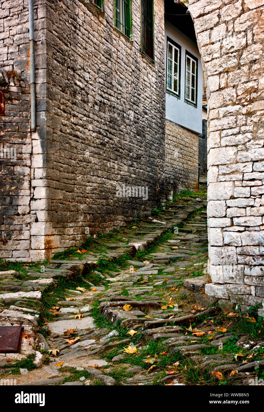 A typical stone alley in Dilofo village, one of the most beautiful Greek mountainous villages, Zagori, Ioannina, Epirus, Greece. Stock Photo