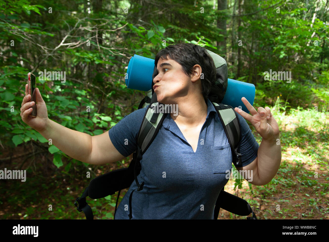 person posing for a selfie while exploring nature Stock Photo