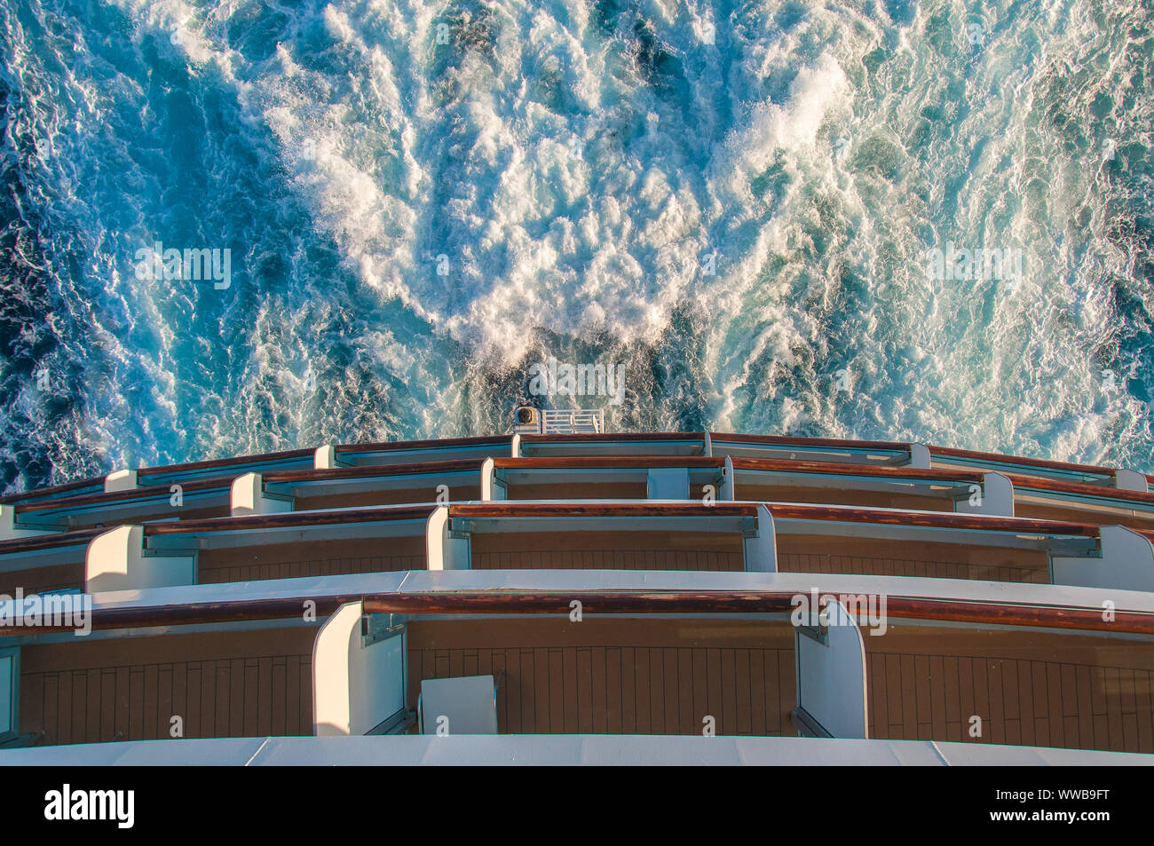 Detail of the stern of a cruise ship and the foam left by the