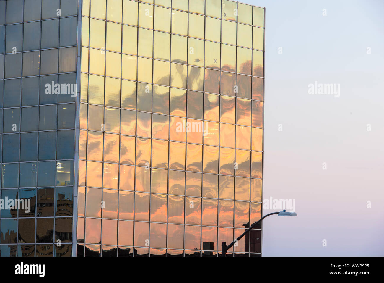 Downtown Sudbury in the evening- reflections in the Scotia Bank building, Greater Sudbury, Ontario, Canada Stock Photo