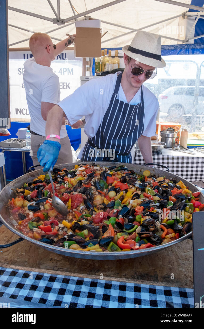 Chefs from Pissaro's restaurant prepare a colourful paella at the annual Hastings Seafood Festival 2016 Stock Photo