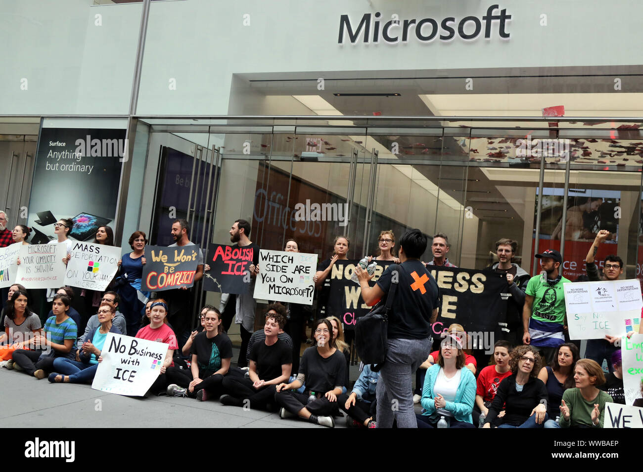 New York, USA. 14th Sep, 2019. Activists protesting the U.S. Immigration and Customs Enforcement (ICE) policies and family separation practices, rallied on the steps of the NYC Public Library on 14 September, 2019 and then marched to technology giant Microsoft's Fifth Avenue retail store, where they joined other protesters who had already blockaded the entrance and some, occupied the interior of the store. Credit: G. Ronald Lopez/ZUMA Wire/Alamy Live News Stock Photo