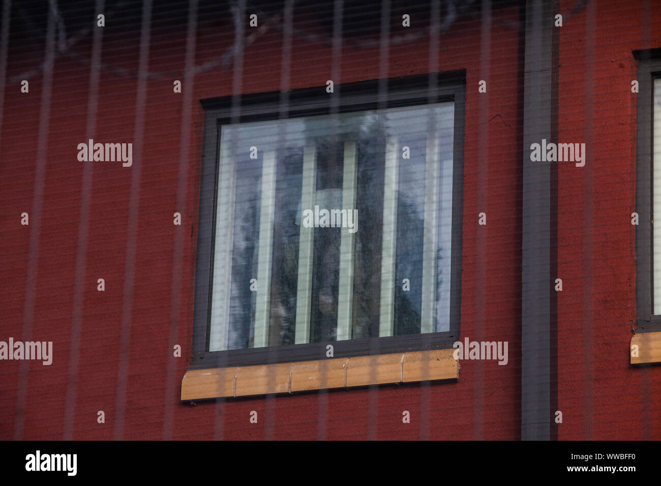 London, UK. 14 September, 2019. Detainees display a message in a window at Harmondsworth detention centre, part of Heathrow Immigration Removal Centre, during a protest by activists from Movement for Justice following the death on 12th September of Oscar Okwurime, a detainee from Nigeria. According to the Home Office, the police, coroner and prisons and probation ombudsman are currently investigating the death in detention. Credit: Mark Kerrison/Alamy Live News Stock Photo