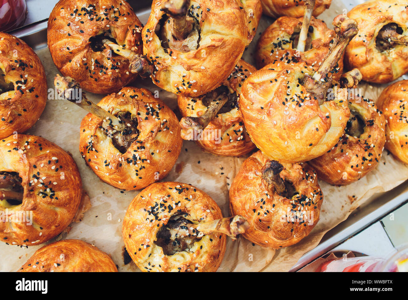 Chicken legs in pastry.Chicken leg in puff pastry on table.Baked chicken Stock Photo