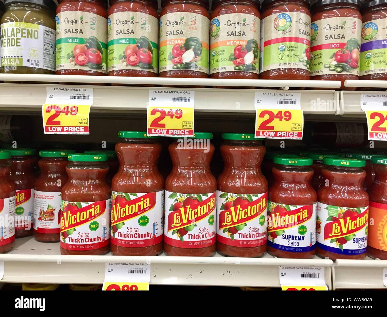 Jars of salsa on a store shelf Stock Photo