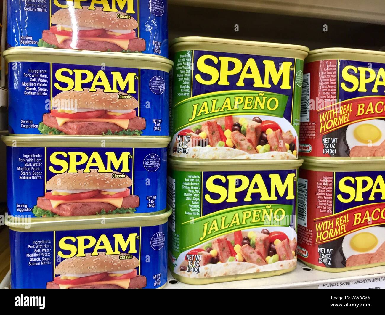 Cans of Spam lunch meat on a store shelf Stock Photo