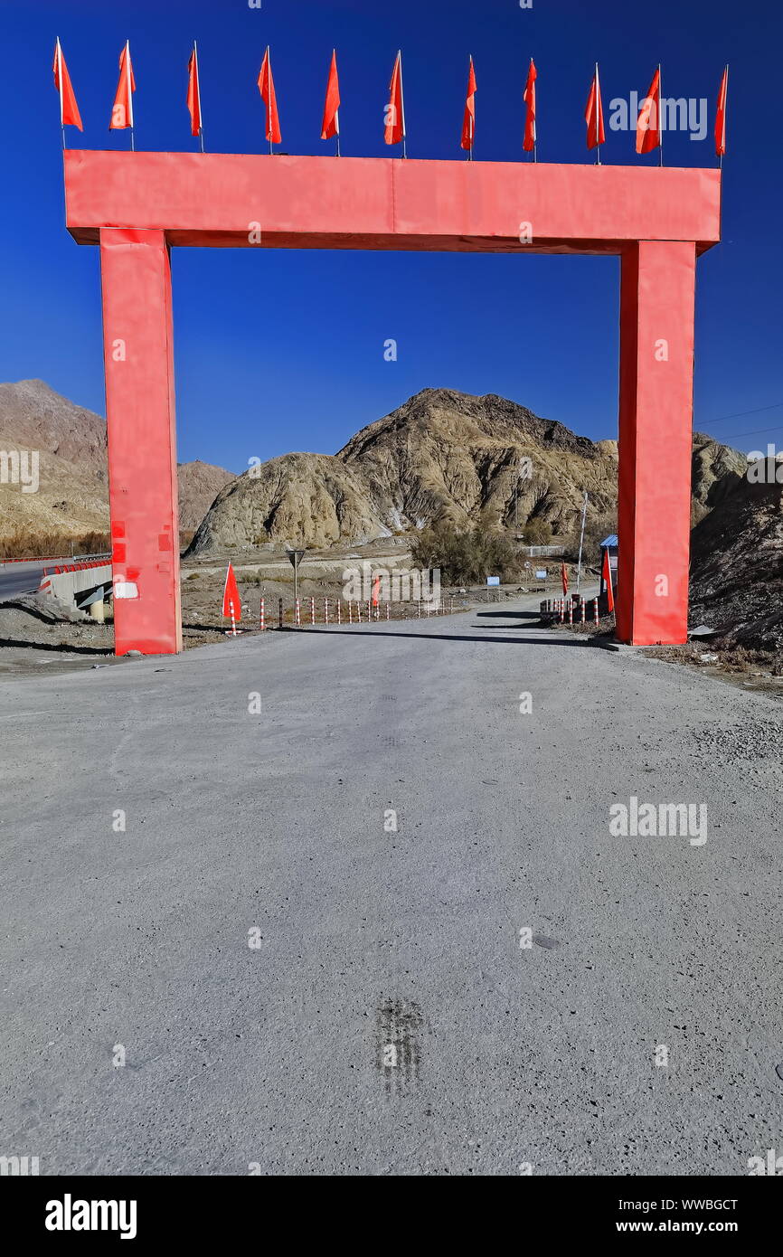 Red arch-entrance of road maintenance facility-Nnal.Highway G315. Ruoqiang county-Xinjiang-China-0497 Stock Photo