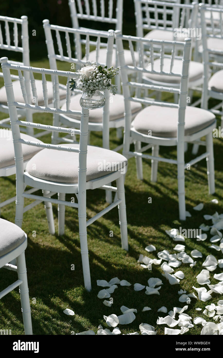 white chairs for luxury wedding decoration guests reception Stock Photo Alamy