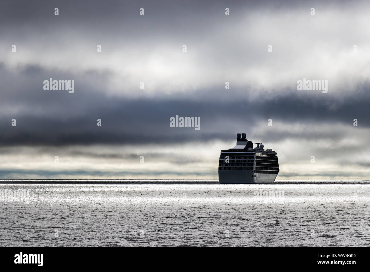 A cruise ship at the Bering sea entering to stormy weather. Stock Photo