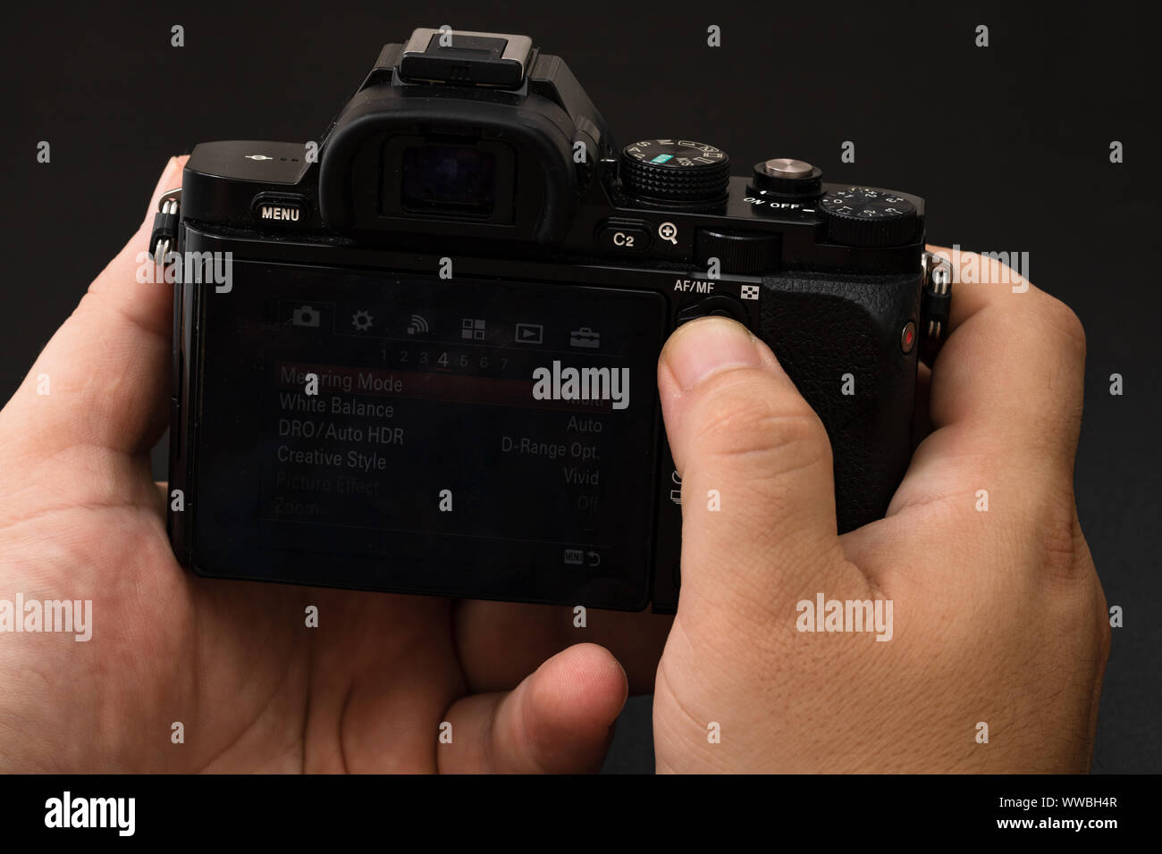 Male hand using photo camera. Close up man hand on photo camera on ...