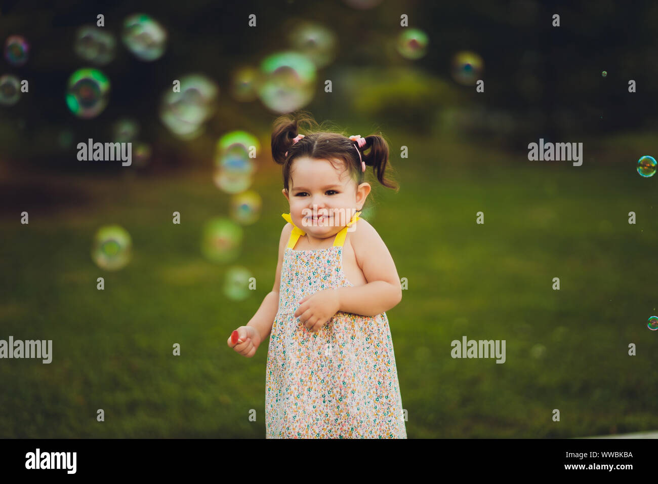 The image of a cute little girl with bubbles Stock Photo Alamy