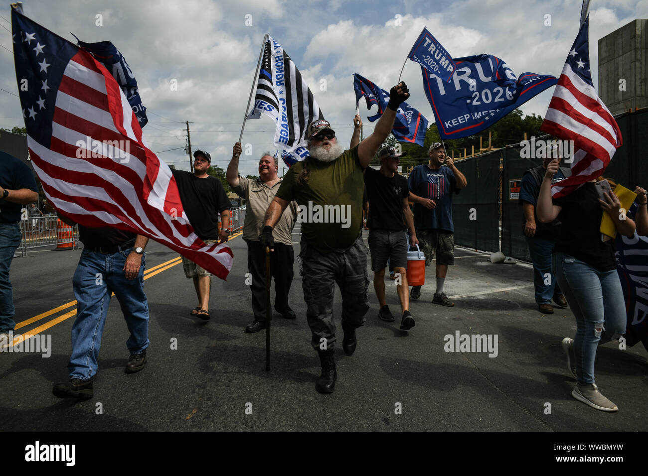 Dahlonega, Georgia, USA. 14th Sep, 2019. Trump supporters joined longtime white nationalist leader Chester Doles in what Doles billed as 'American Patriot Rally'' to honor President Trump in Dahlonega, Georgia on Saturday. All told, around 50 people joined Doles' rally, while around 100 people''”including members of the so-called 'Antifa'' movement''”turned out to protest the event, which drew hundreds of law enforcement officers from surrounding counties Credit: Miguel Juarez Lugo/ZUMA Wire/Alamy Live News Stock Photo