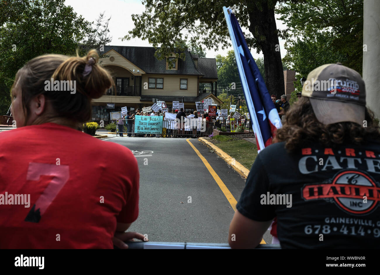 Dahlonega, Georgia, USA. 14th Sep, 2019. Trump supporters joined longtime white nationalist leader Chester Doles in what Doles billed as 'American Patriot Rally'' to honor President Trump in Dahlonega, Georgia on Saturday. All told, around 100 people joined Doles' rally, while around 200 people''”including members of the so-called 'Antifa'' movement''”turned out to protest the event, which drew hundreds of law enforcement officers from surrounding counties. Credit: Miguel Juarez Lugo/ZUMA Wire/Alamy Live News Stock Photo