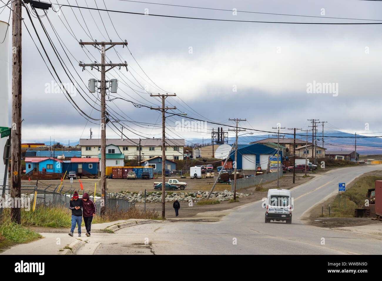 The Seppala Dr with wooden electric poles in the center of Nome, Alaska