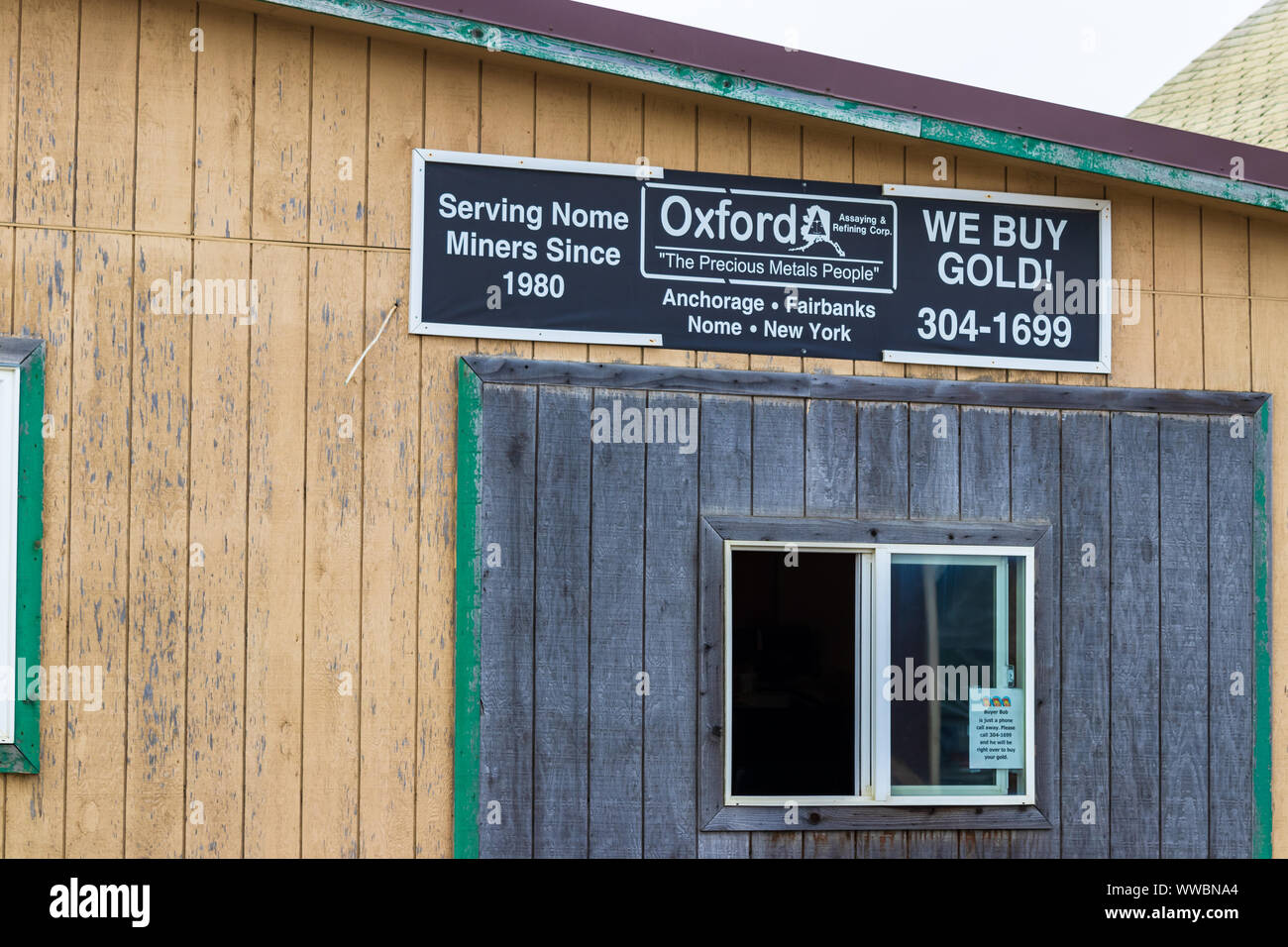 The storefront of a gold buyer service in the center of Nome, Alaska. Stock Photo