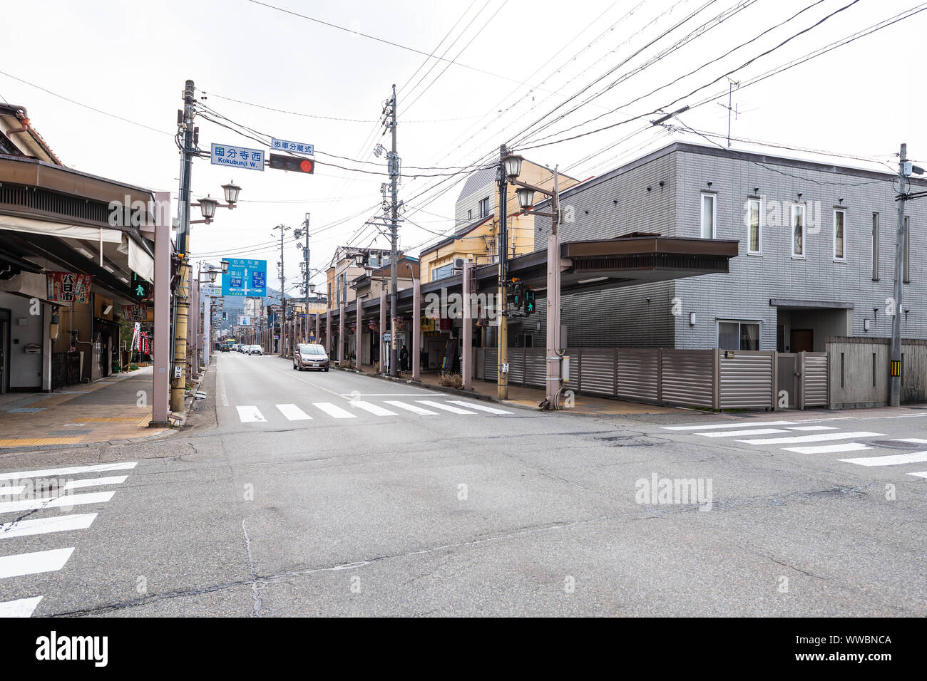 Takayama, Japan - April 7, 2019: Main Kokubunji street in downtown center of small countryside historic village or city town in Gifu prefecture with s Stock Photo