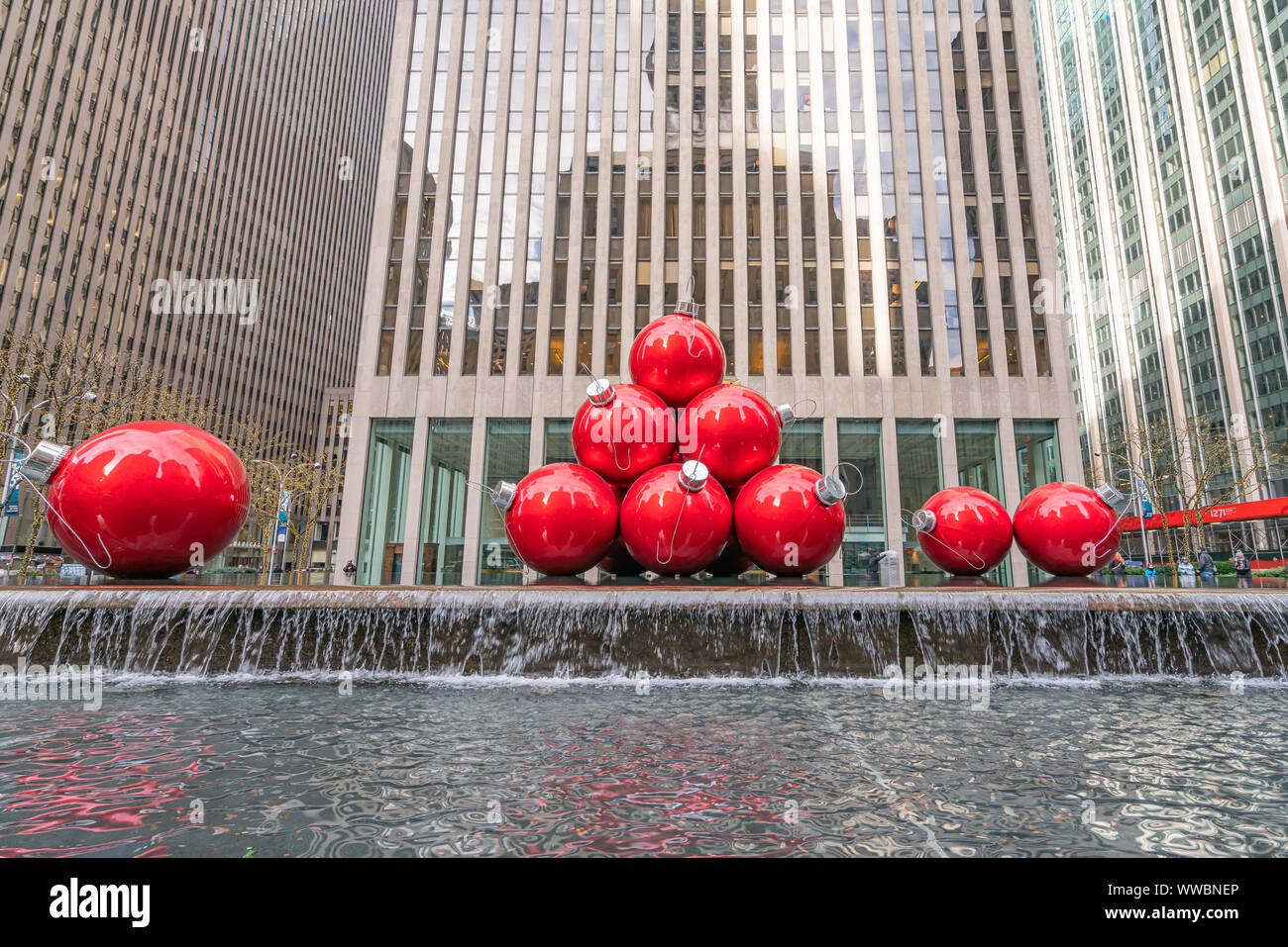 New York, NY, USA - December, 25th, 2018 - Streets of Manhattan, Sixth Avenue with huge red Christmas decoration balls, near Radio City Music Hall, NY Stock Photo