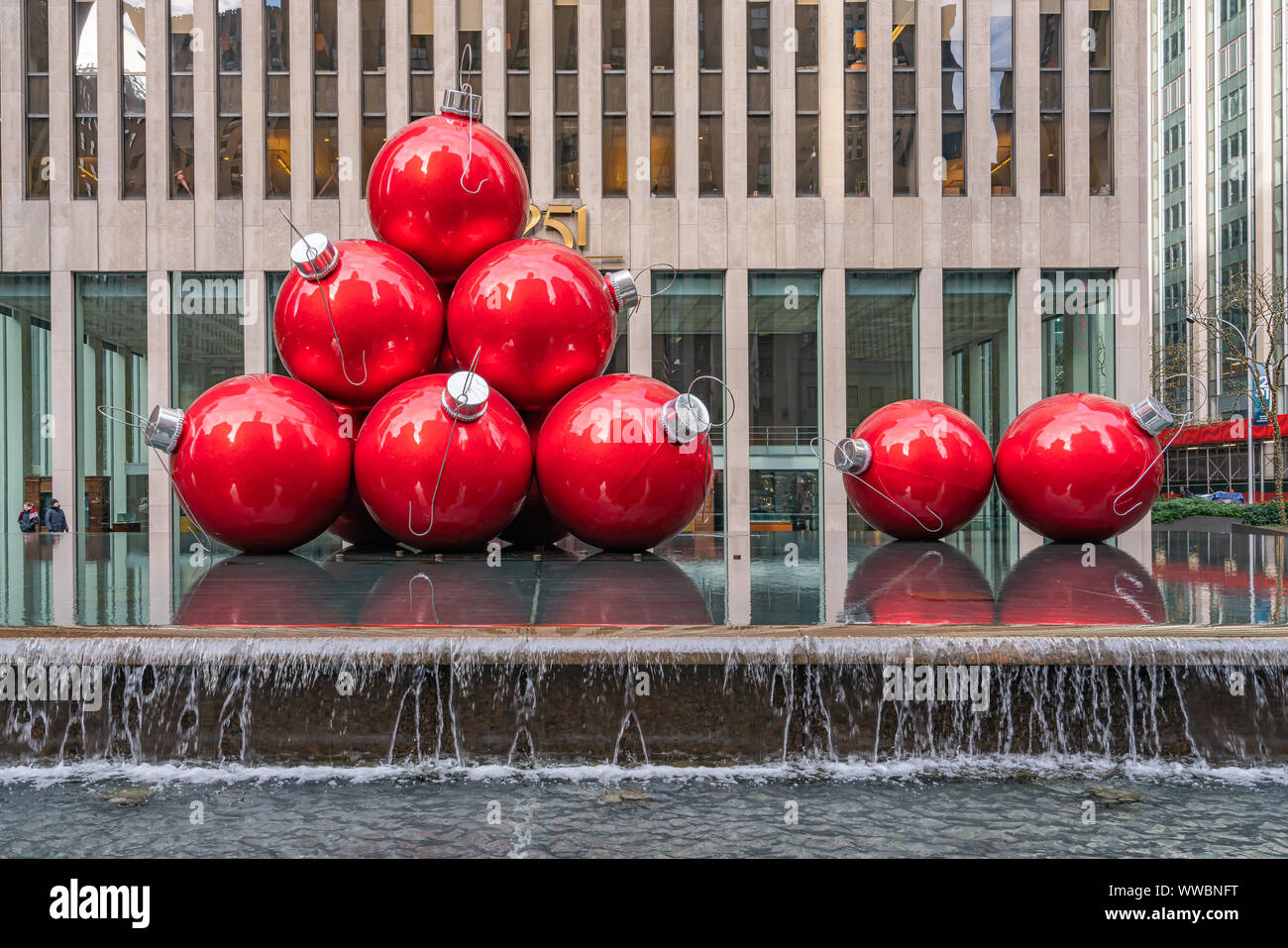 New York, NY, USA - December, 25th, 2018 - Streets of Manhattan, Sixth Avenue with huge red Christmas decoration balls, near Radio City Music Hall, NY Stock Photo