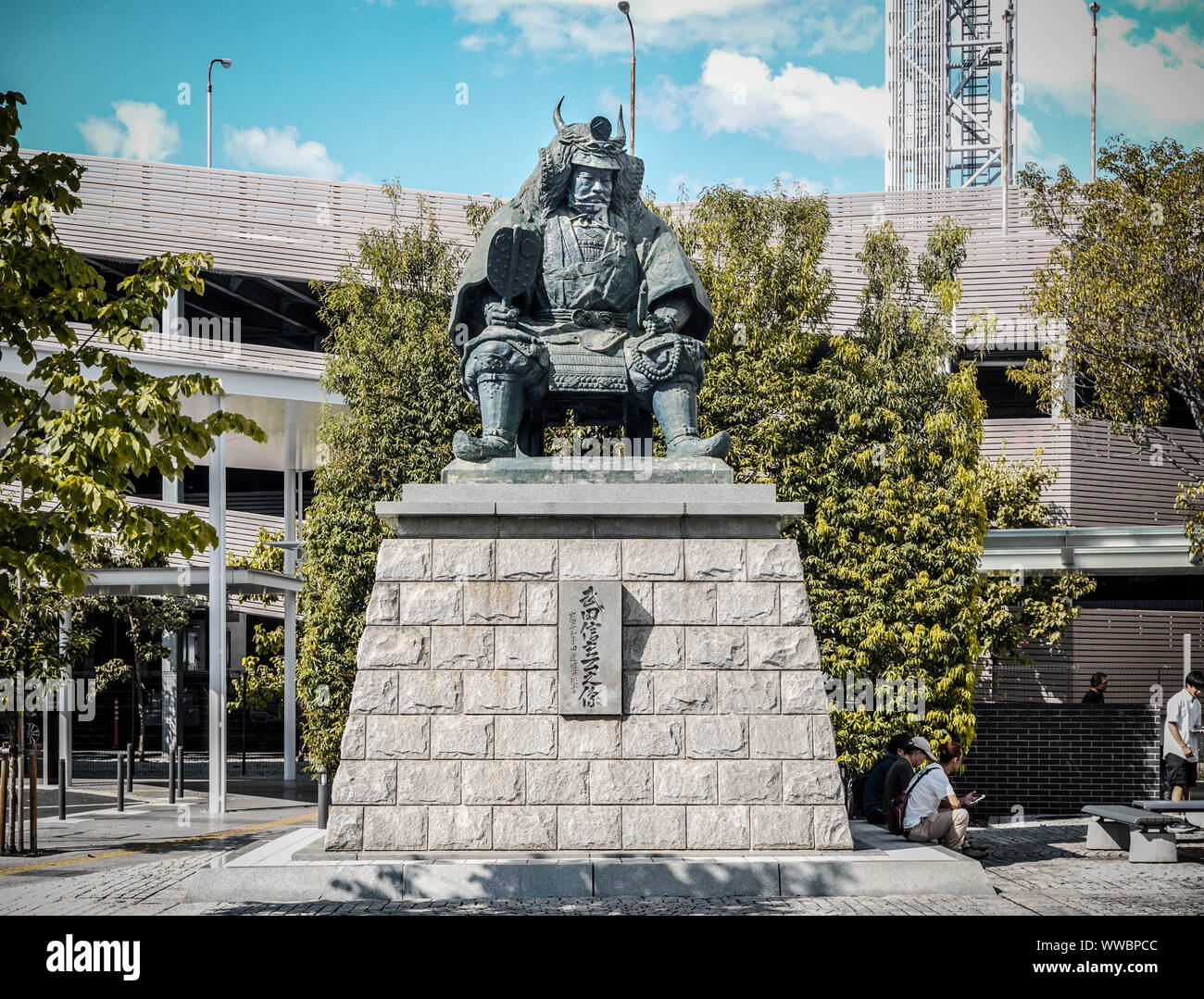 Statue of general Takeda Shingen next to a public phone booth in Shioyama, Koshu City, Yamanashi, Japan Stock Photo