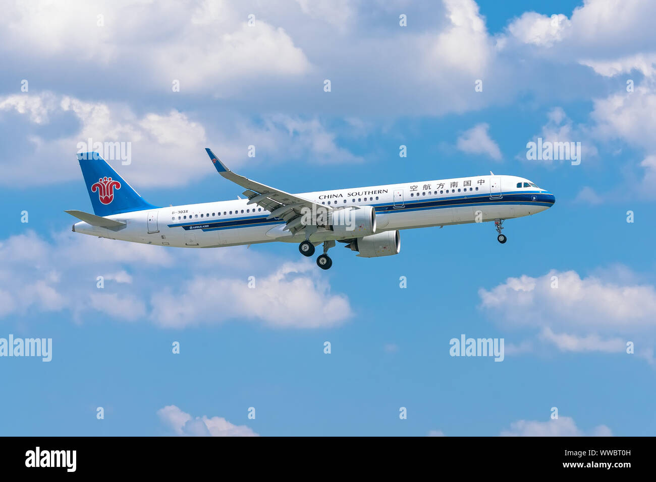 Airplane airbus A321 of China Southern Airlines flying through sky prepare to landing at Tan Son Nhat International Airport, Ho Chi Minh City, Vietnam Stock Photo