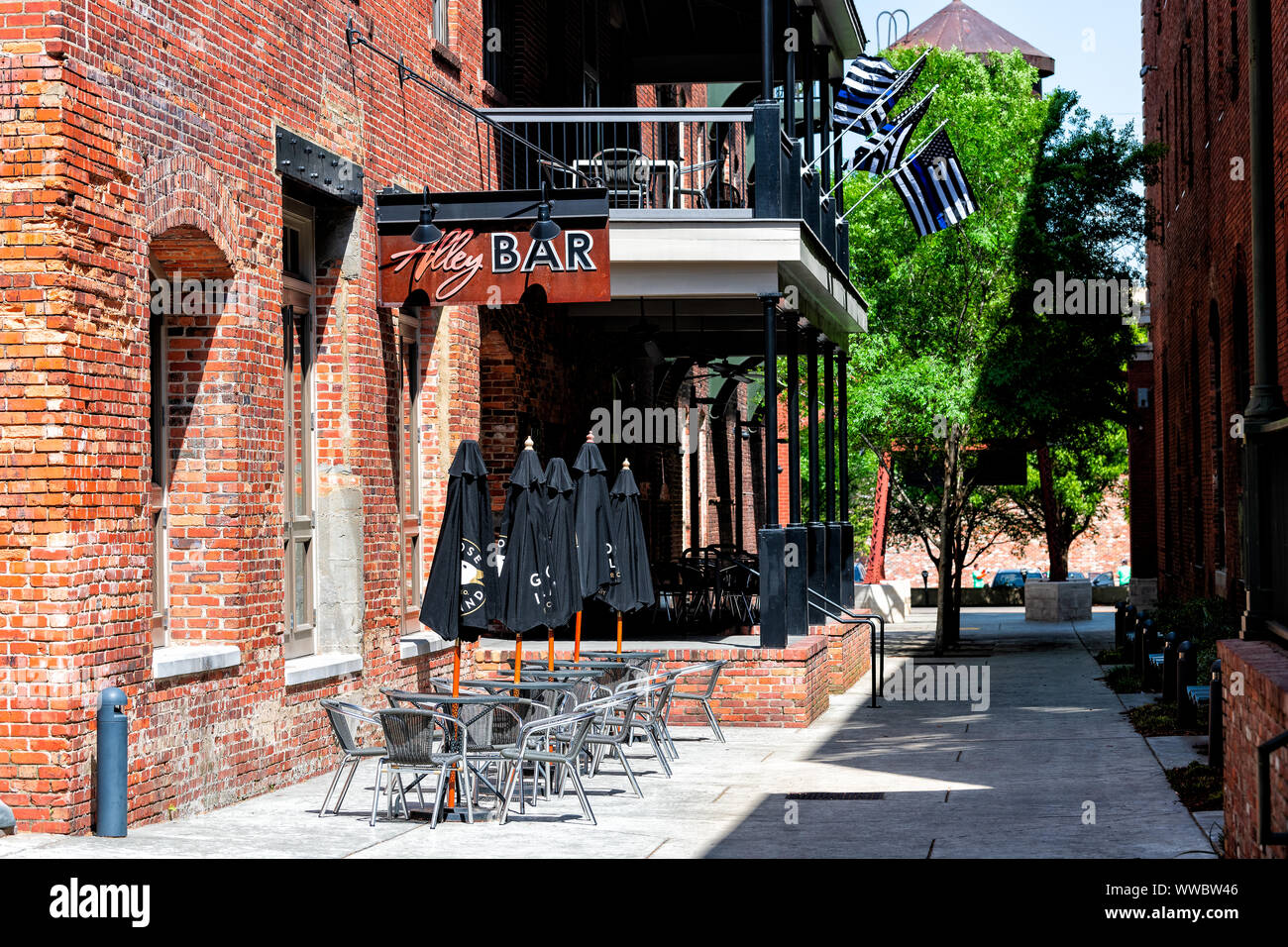 Montgomery, USA April 21, 2018 Brick buildings restaurant bar on Alley street during day in