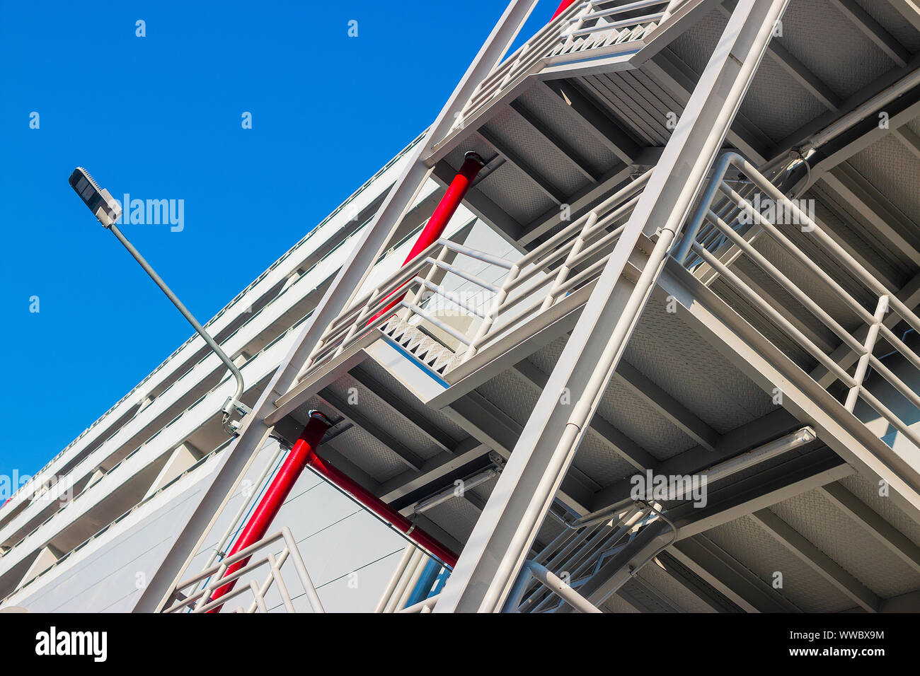 Fire escape ladder or emergency exit with steel staircase on wall of modern  industrial building Stock Photo - Alamy