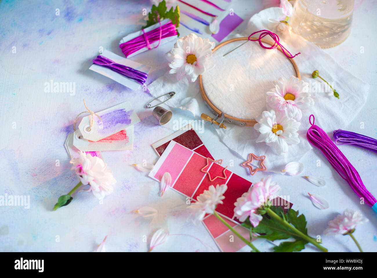 Embroidery frame header with flowers. Pink, white and purple pastel tones, copy space Stock Photo