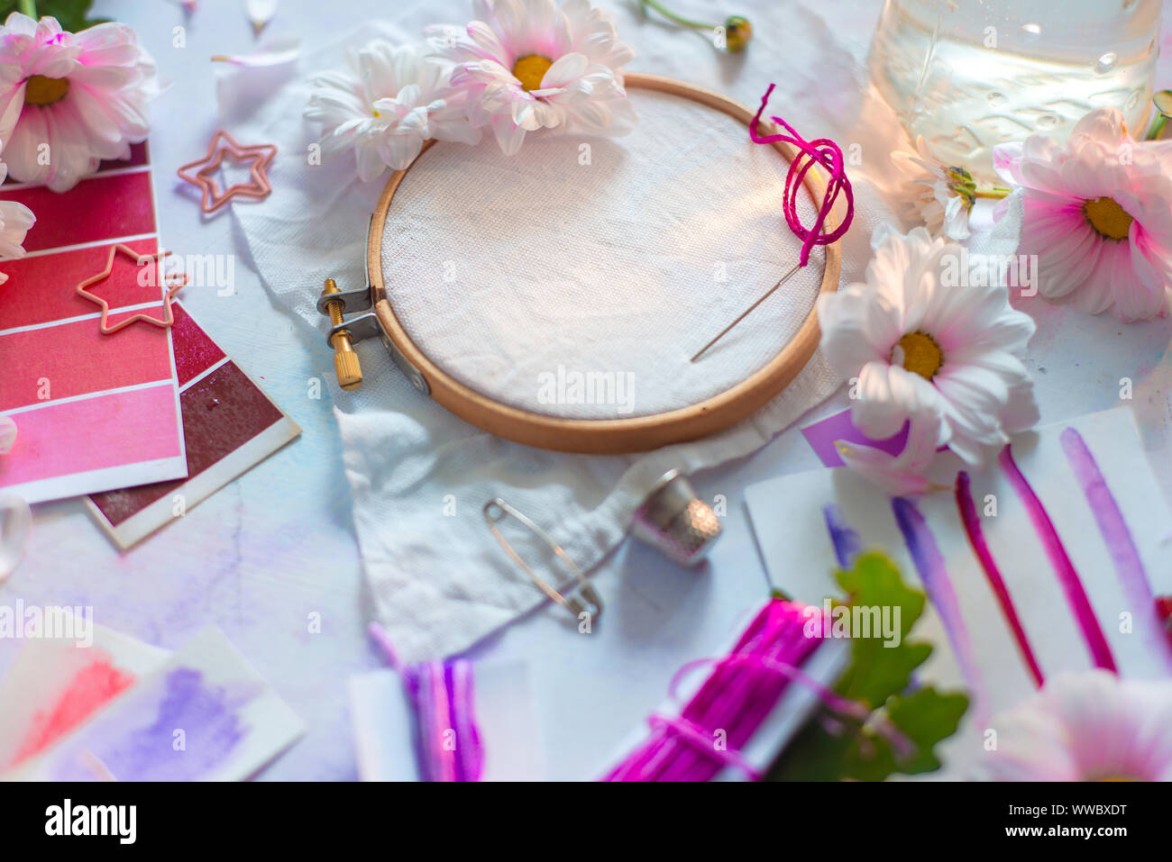Embroidery frame header with flowers. Pink, white and purple pastel tones, copy space Stock Photo